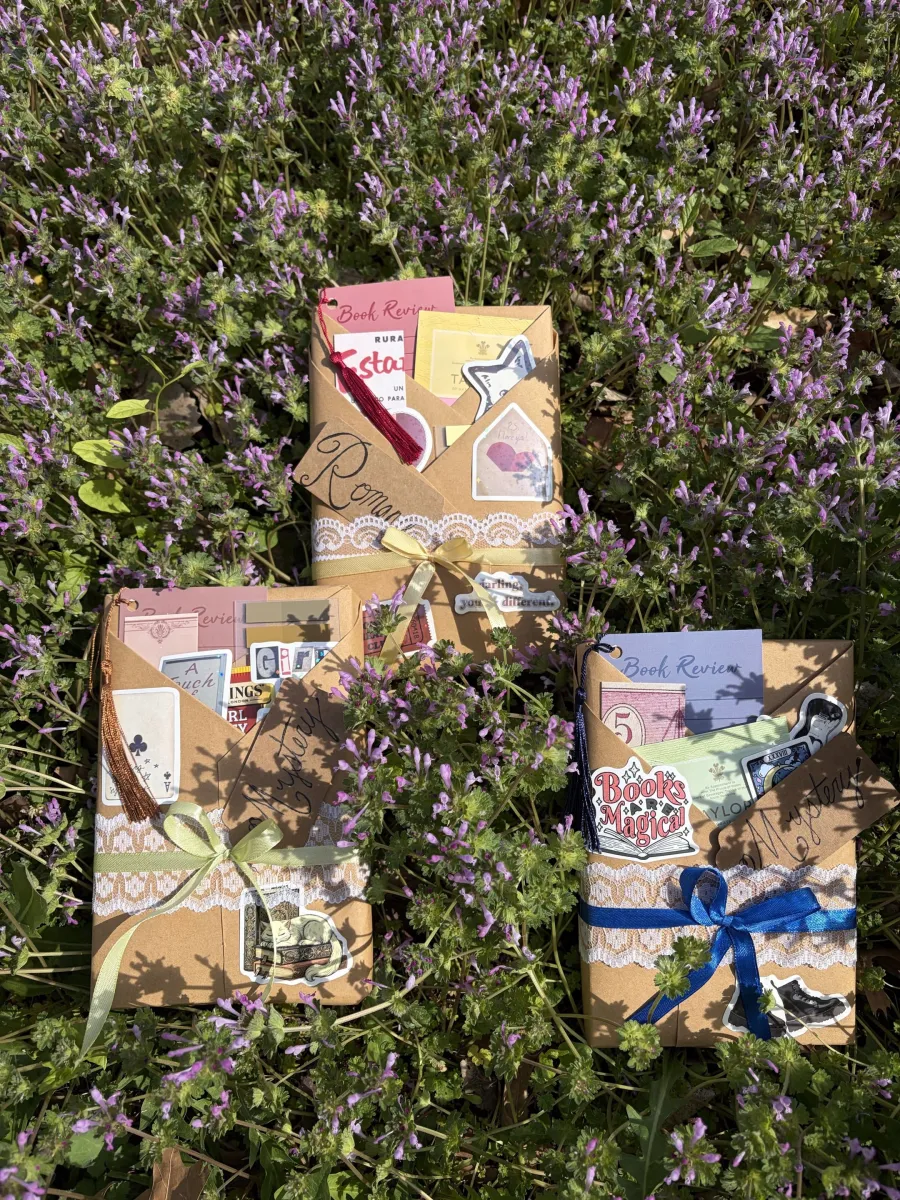 Wrapped books arranged in a field of flowers